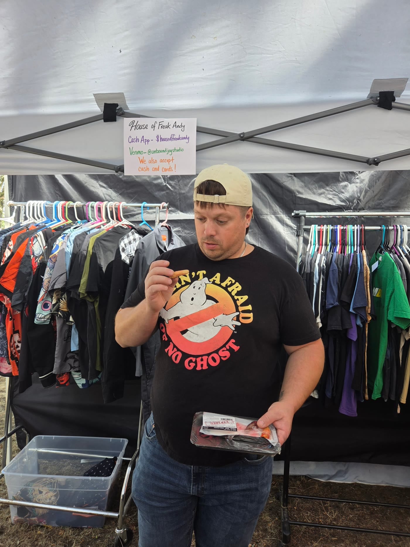 A customer checking out a Curs-ed Confection at our booth