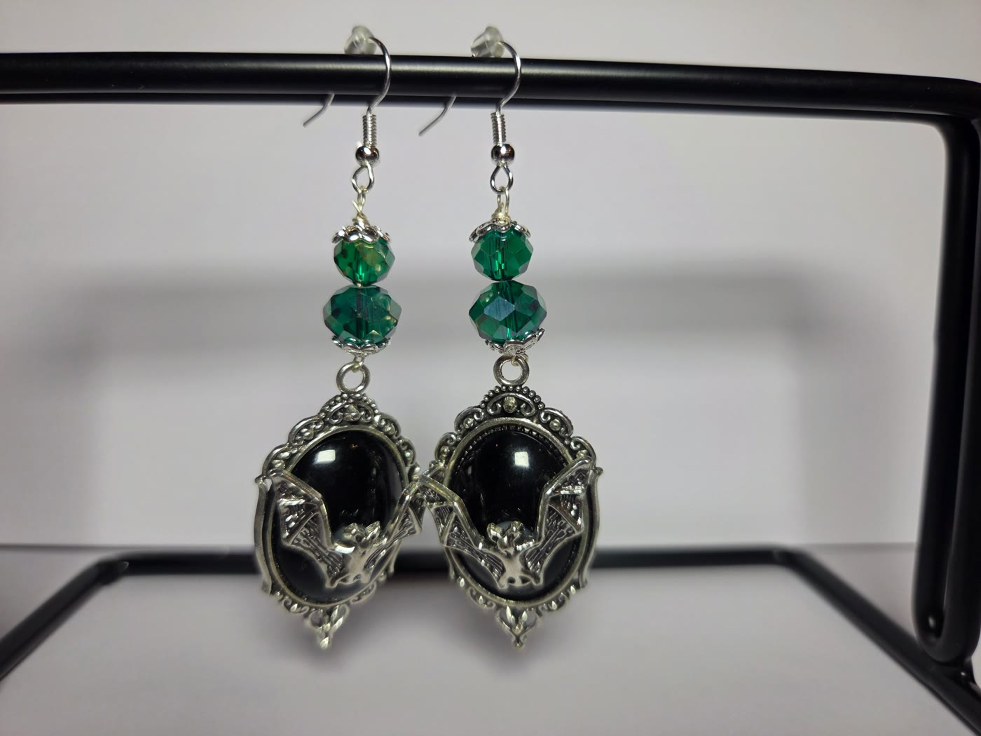 Silver bat cameo earrings with green crystal beads