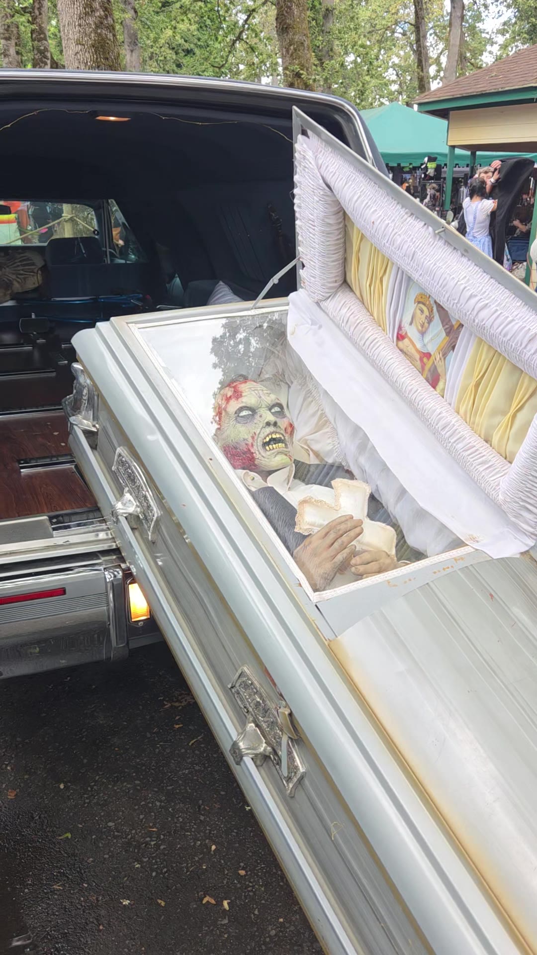 Our hearse with an open casket and a zombie inside, the photo-op station