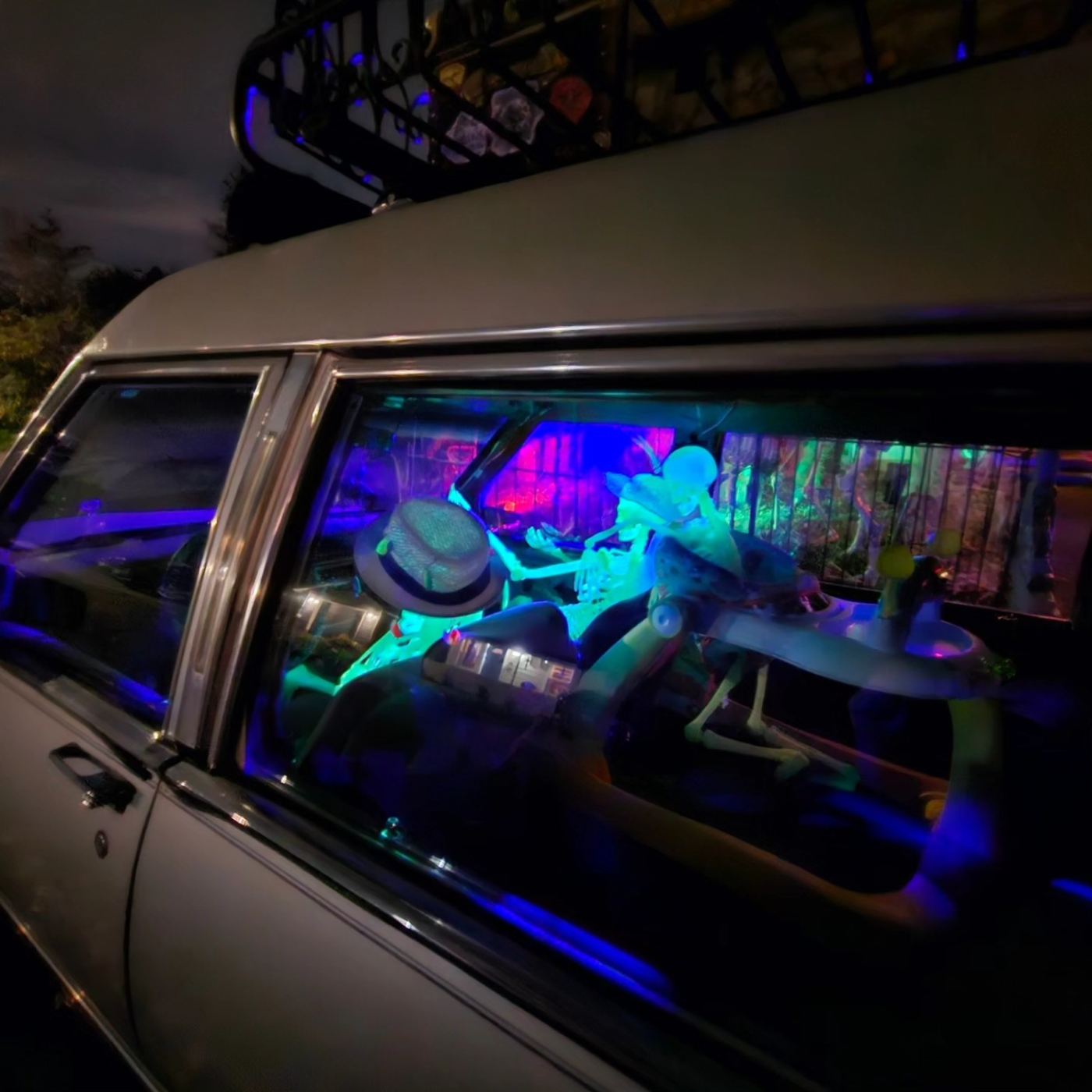 Elvira the hearse, lit up at night
